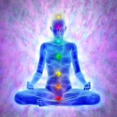 Woman in yoga meditation -  aura and chakras