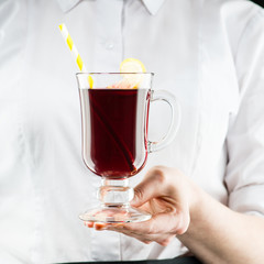 The unidentified waiter brings a hot non-alcoholic mulled wine with orange and cinnamon