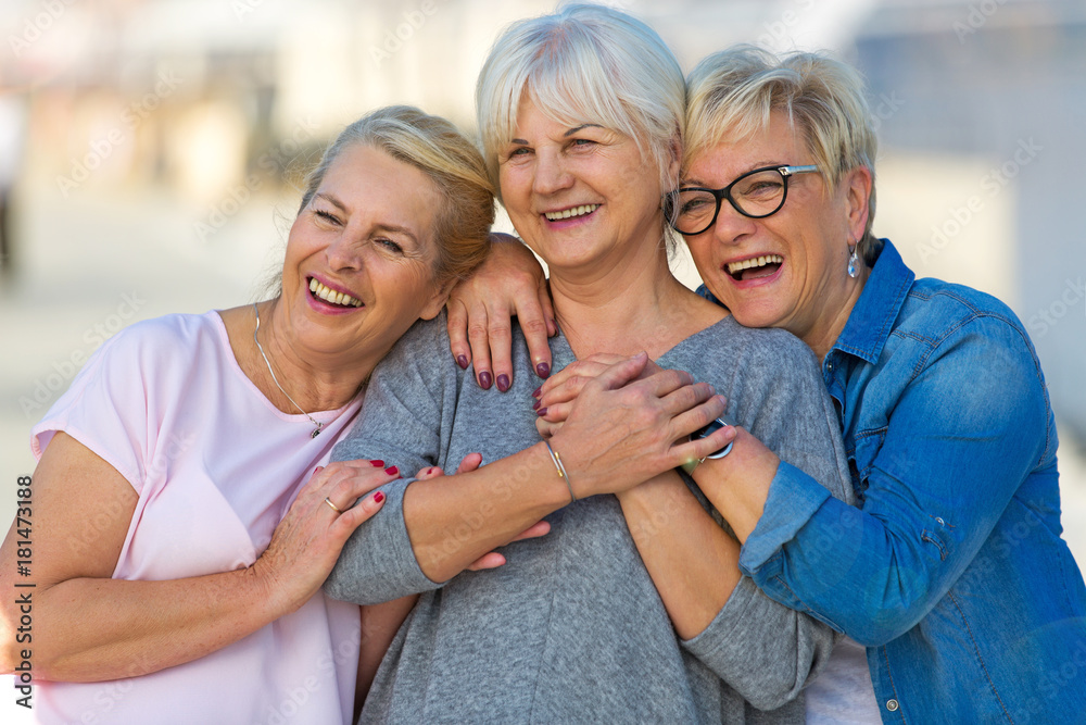 Canvas Prints group of smiling senior women standing outside