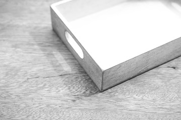 Empty white wooden crate on wooden background