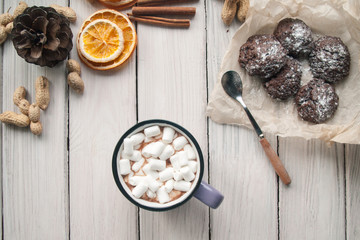 Christmas composition: christmas decoration, orange cake, hot cacao with marshmallows. Flat lay style, top view.