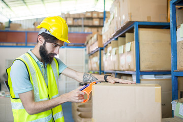 Warehouse worker checking stock products for prepare to packing to customer.