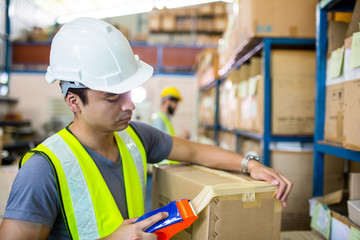 Warehouse worker checking stock products for prepare to packing to customer.