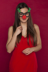 young beautiful woman with a funny Christmas gift