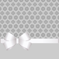 Vector Invitation card with white holiday ribbon and bow on grey background. Gift Voucher Template  with  place for text.