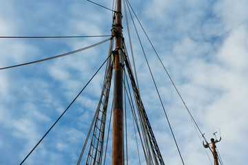 ship's sparrow with wires and ropes under the blue sky