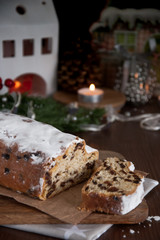Fototapeta na wymiar Sliced Christmas Stollen. Traditional german christmas cake with dried fruits and icing sugar
