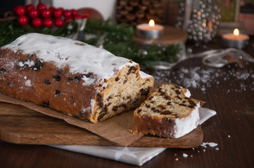 Sliced Christmas Stollen. Traditional german christmas cake with dried fruits and icing sugar