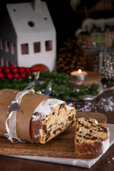 Sliced Christmas Stollen. Traditional german christmas cake with dried fruits and icing sugar