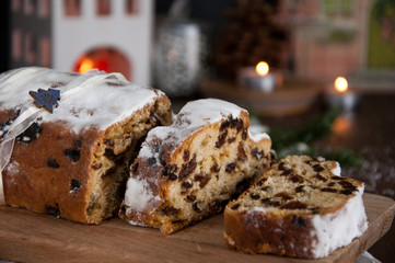 Sliced Christmas Stollen. Traditional german christmas cake with dried fruits and icing sugar