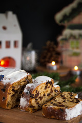 Sliced Christmas Stollen. Traditional german christmas cake with dried fruits and icing sugar
