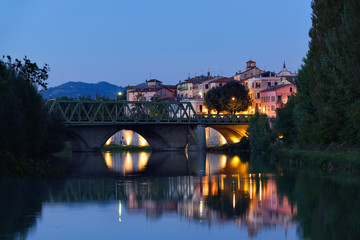 Old city reflection in Tevere river, Umbertide, Italy