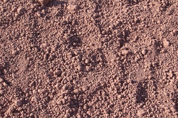 Red stony desert soil texture background