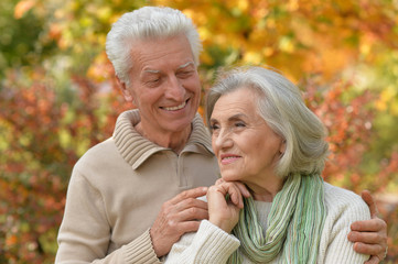 senior couple hugging in the park