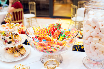 Colorful lollipops on a festive table