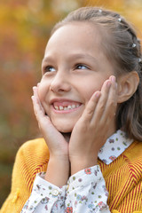  girl smiling in autumnal park