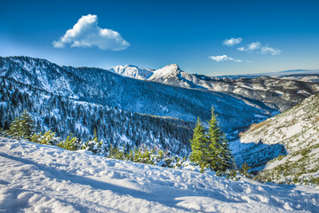 Mountain peak Giewont from between hillocks defile, Tatra mountains, Poland