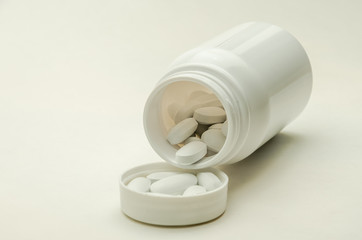 Bottle with pills isolated on white background