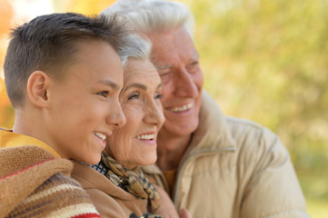 grandparents and grandson in park