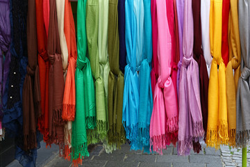 Assorted colorful scarves in retail display
