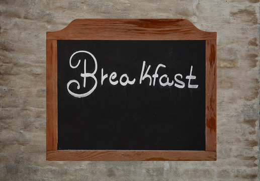 Chalk word breakfast on vintage blackboard on wall