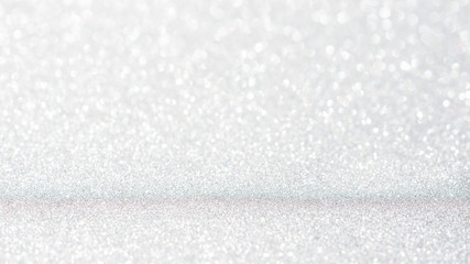 white glitter and bokeh for a background.