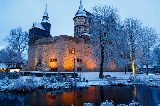 German fairytale castle in winter landscape. Castle Romrod in Hessen, Germany