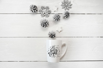 Christmas text O holly hight on a white mug with a christmas decor. Photography for holiday greeting card, invitation, calendar poster banner