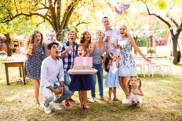 Family celebration or a garden party outside in the backyard.