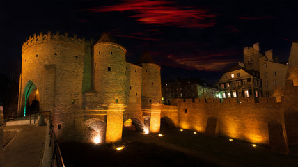 Panorama of Warsaw at night - view of the Barbican and Old Town