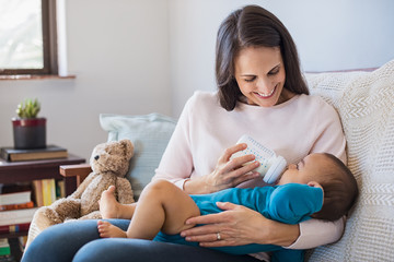 Mother feeding her baby © Rido