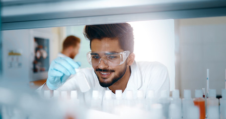 Male student of chemistry working in laboratory
