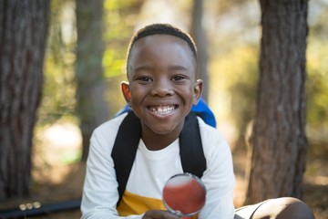 Portrait of happy boy holding magnifying glass © WavebreakMediaMicro