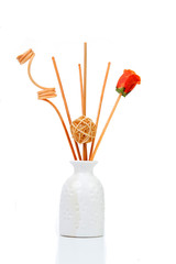 fragrant sticks in a white jug on a white background