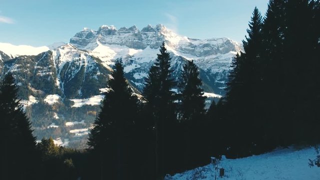 Stunning Drone footage over the high mountain alpine peaks of the Dents du Midi overlooking Champery in Switzerland.