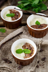 Chocolate and vanilla custard cream dessert Vla served with mint leaves