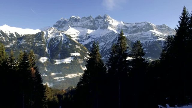 Stunning Drone footage over the high mountain alpine peaks of the Dents du Midi overlooking Champery in Switzerland.