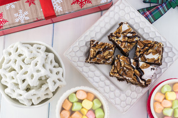 Christmas table with hot cocoa, brownies and pretzels.