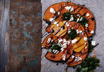 Baked Pumpkin with kale, persimmon and feta © Sebastiana Raw