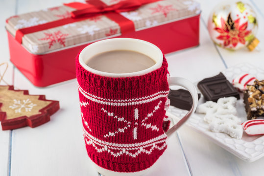 Christmas cover mug with hot cocoa with milk.