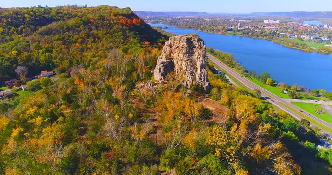 Aerial flyby of scenic Sugarloaf Rock by Lake Winona, Minnesota.
