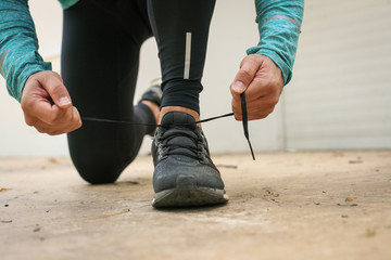 Tying shoe. Close up.