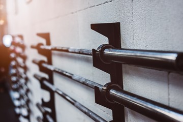 Barbell weight bars on the stand