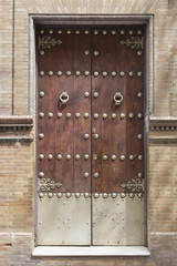 Wooden door with iron handles