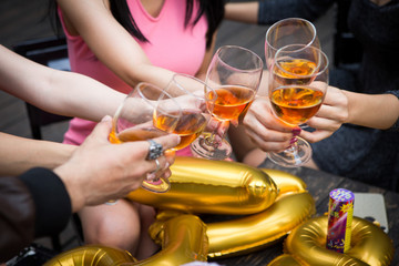 Hand of friends greeting in New year party and celebrating