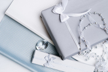 luxury jewelry gifts for top class on grey background. professional present wrapping for toffs on birthday, new year, christmas, thanksgiving, valentines day and other holidays.
