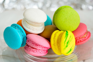 Colorful french macarons background, close up.Different colorful macaroons background.Tasty sweet color macaron,Bakery concept.Selective focus.