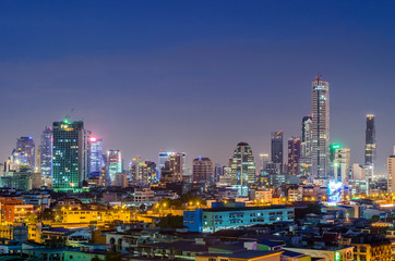 Fototapeta na wymiar a view over the big asian city of Bangkok , Thailand at night time when the tall skyscrapers are illuminated and street traffic on june 20,2017