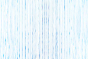 White wooden surface with blue tint for background. Abstract image.