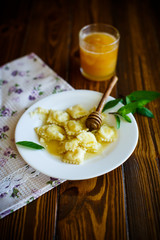 Homemade sweet ravioli with cottage cheese and honey